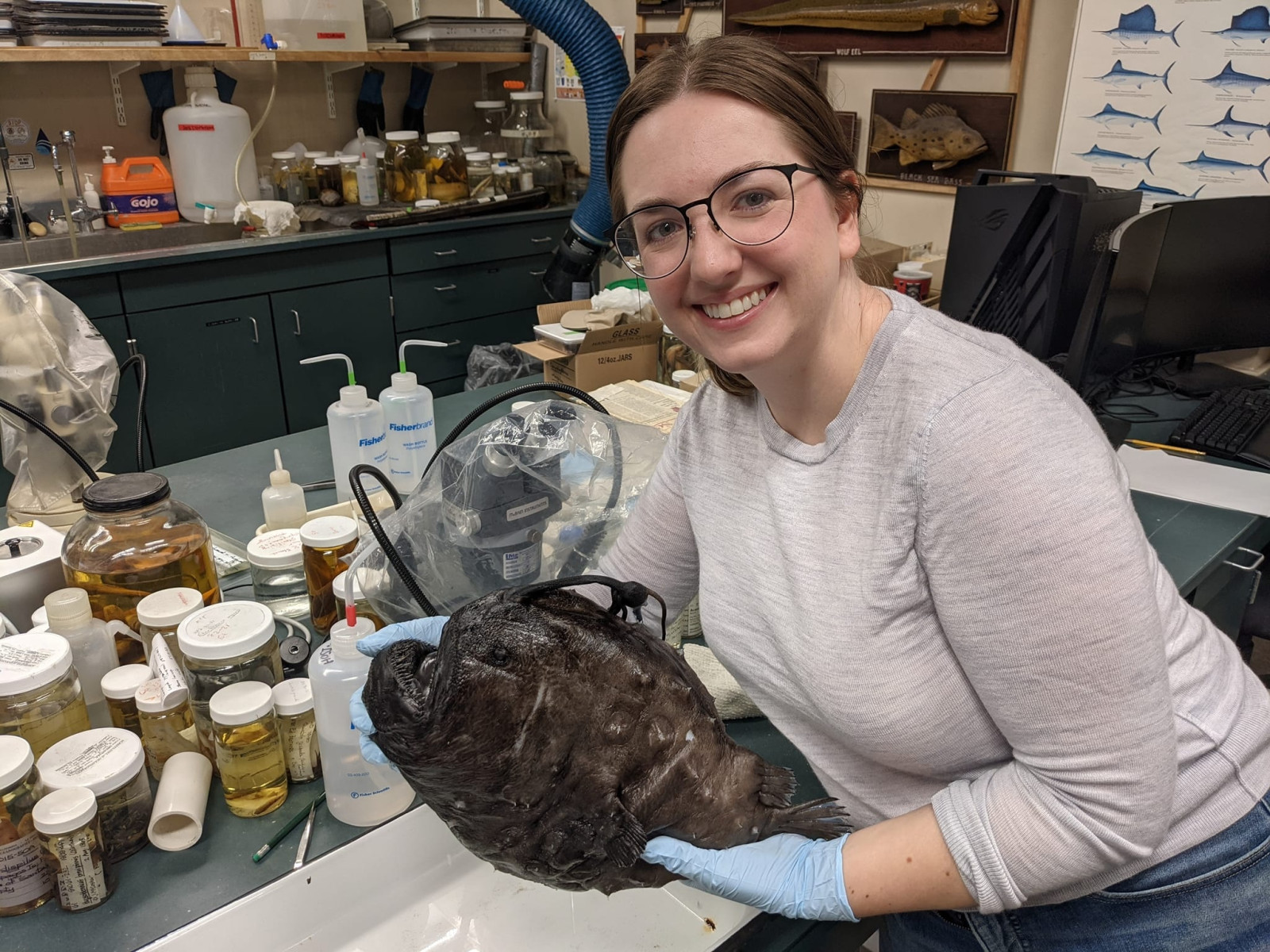 Elizabeth Santos holding an anglerfish, a pelagic species in the deep sea, that washed ashore in San Diego. Photo courtesy of Elizabeth Santos