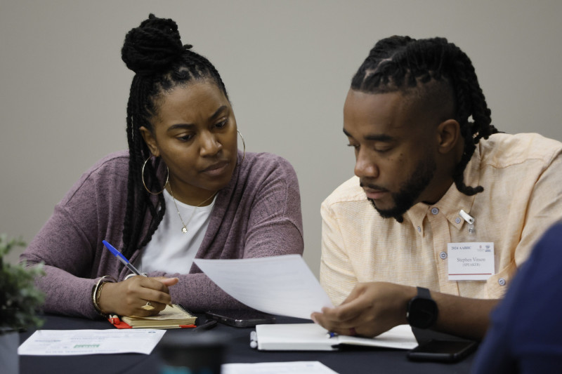 Conference presenters compare notes on breakout sessions.