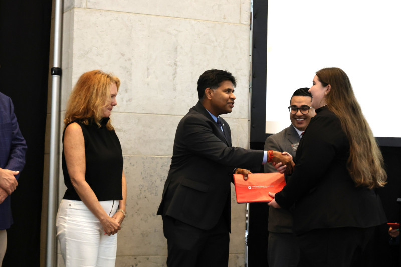 Fisher Interim Dean Aravind Chandrasekaran and CIBER Director Dominic DiCamillo congratulated the students.
