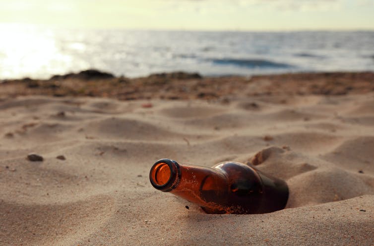 empty beer bottle on beach