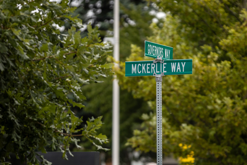 McKerlie Way street sign with trees in background.