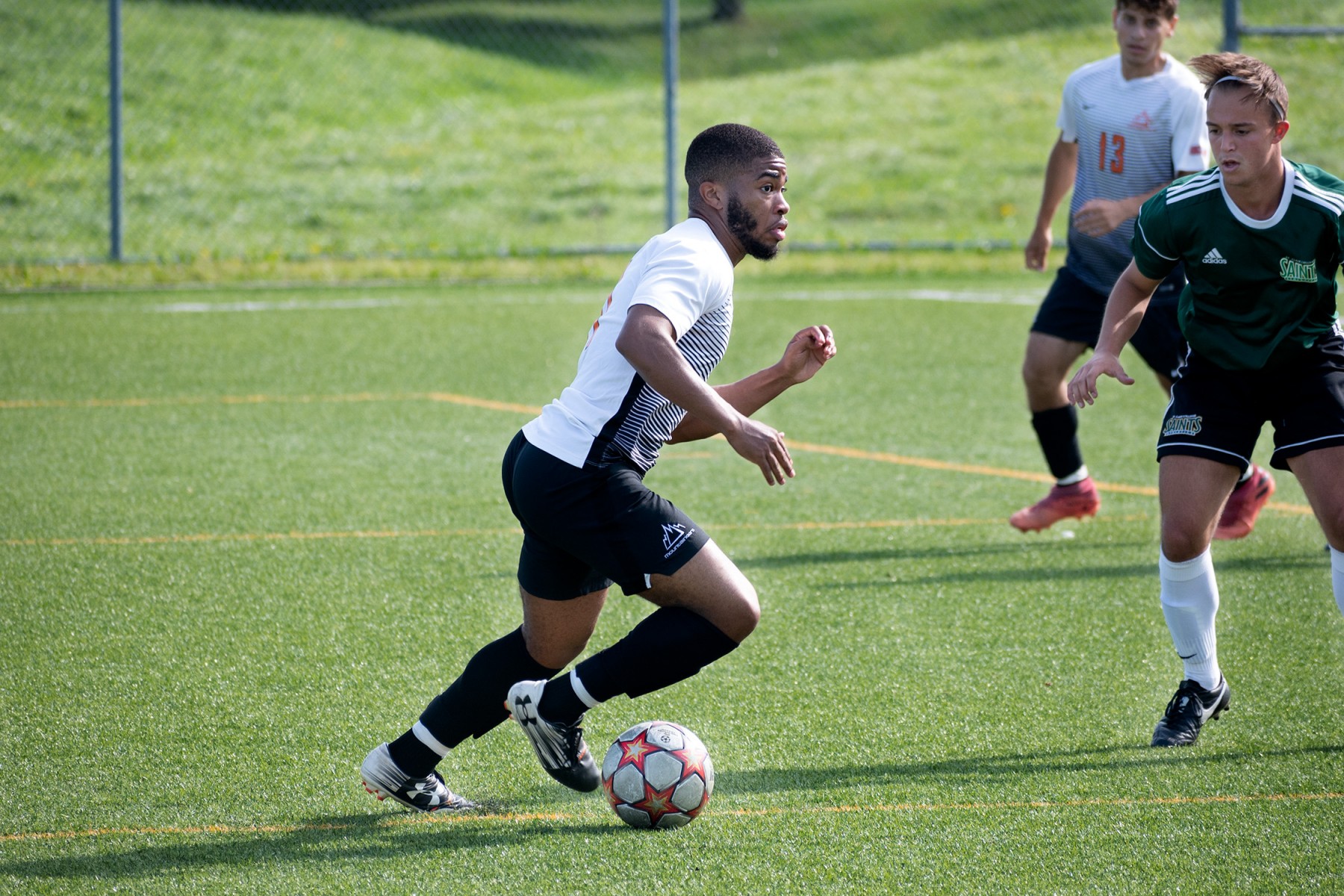Mountaineer men's soccer player running on the pitch