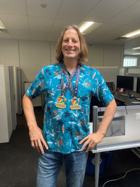 John Van Loon wearing two gold medals.