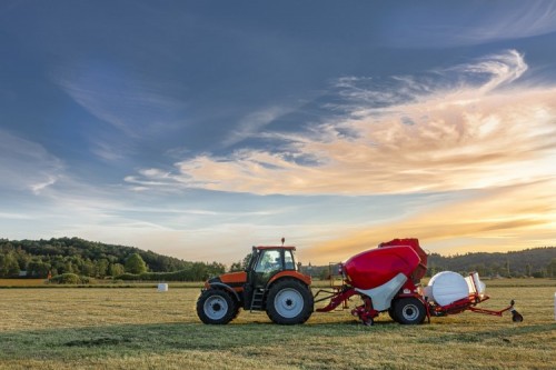 Tractor with silage bale machine