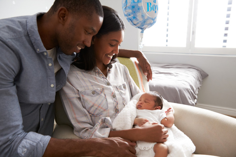 stock-photo-parents-home-from-hospital-with-newborn-baby-in-nursery-627703319.jpg