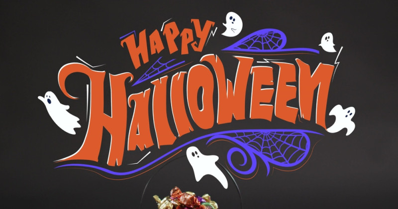stock-photo-image-of-happy-halloween-text-with-ghosts-over-orange-pumpkin-bucket-with-sweets-halloween-2445711479.jpg