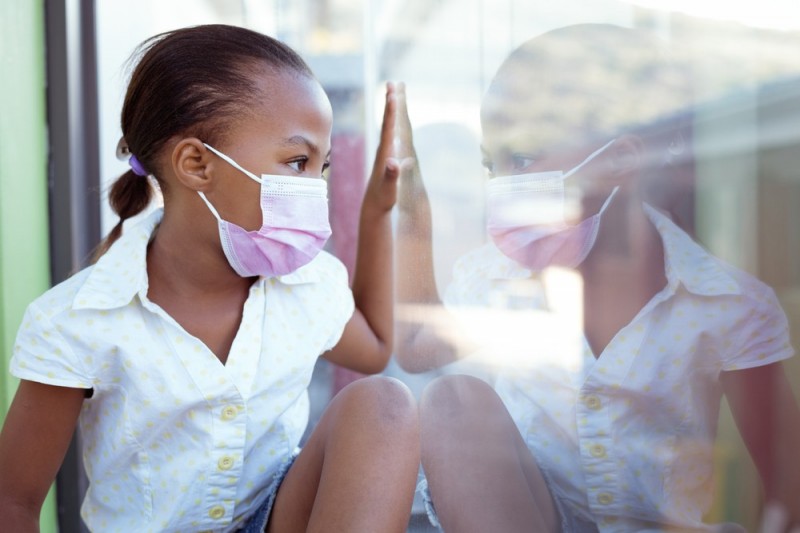 stock-photo-african-american-schoolgirl-wearing-face-mask-sitting-in-school-classroom-looking-out-of-window-2007647681.jpg