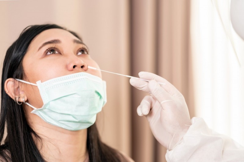 stock-photo-medical-staff-with-ppe-suit-test-coronavirus-covid-to-asian-woman-by-nose-swab-at-hospital-1845943324.jpg