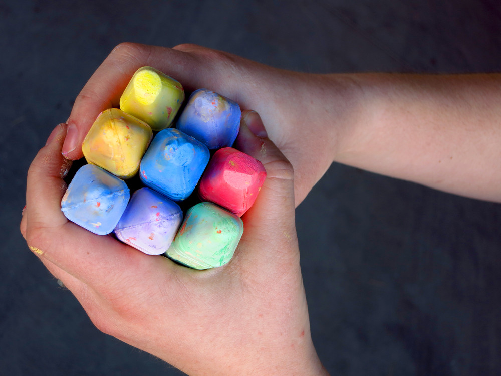 childs-hands-holding-large-colored-450w-309779177.jpg