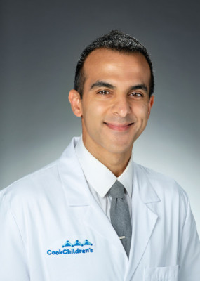 Amit Singh, MD with coat