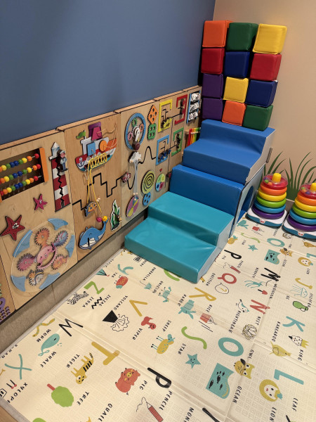 The playroom is filled with toys for kids of all ages.