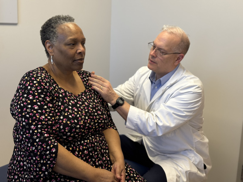 Dr. Biery uses OMT to help Dianne Titus with shoulder pain.