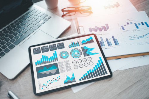 Digital Business Analysis,Growth Data and Charts on Desktop Computer Screen in Modern Office