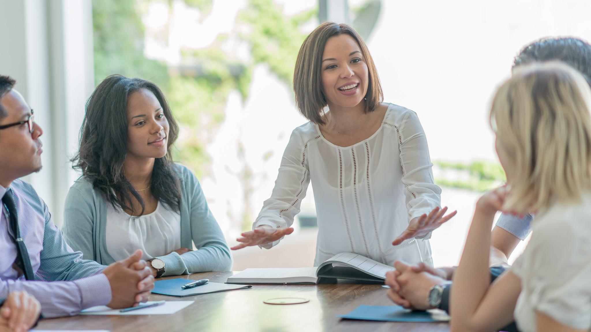 Business managers together in a board room meeting.