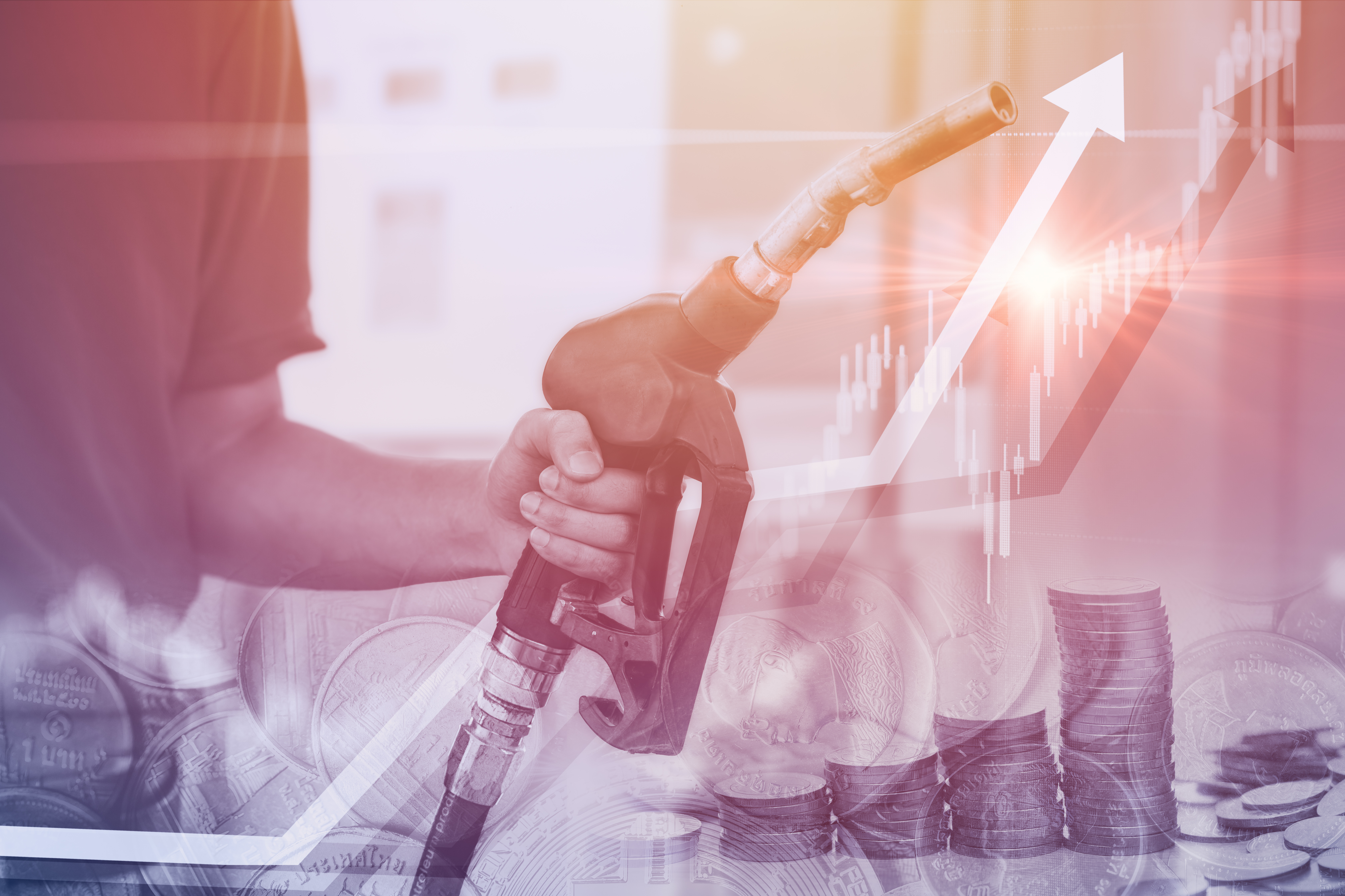 Hand holding a fuel nozzle overlaid with stacked coins, a financial chart and upward-pointing arrows.