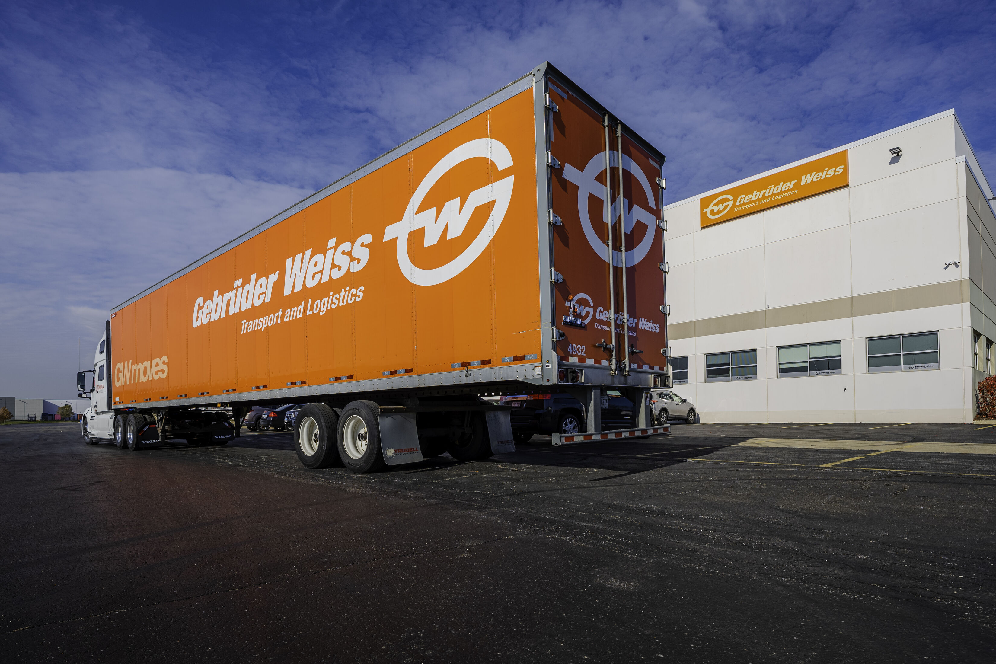 Gebrüder Weiss truck in front of a Gebrüder Weiss warehouse